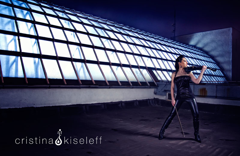Cristina Kiseleff Electric Violinist performing on a rooftop for a new violin video