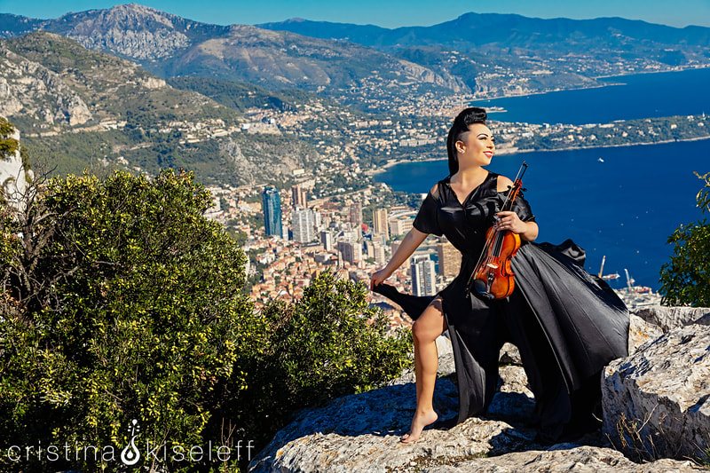 Cristina Kiseleff electric Violinist performing near Monaco City with a beautiful French Riviera background and viewpoint