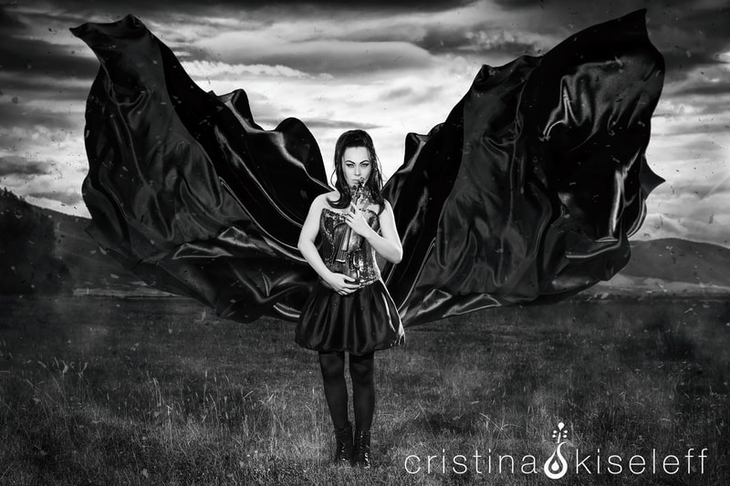 Cristina Kiseleff Electric Violinist Epic BW fantasy portrait with surreal wings on a stormy background