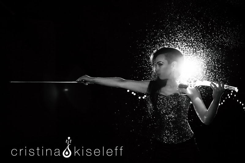 Cristina Kiseleff Electric Violinist Performing in the rain in a black and white portrait