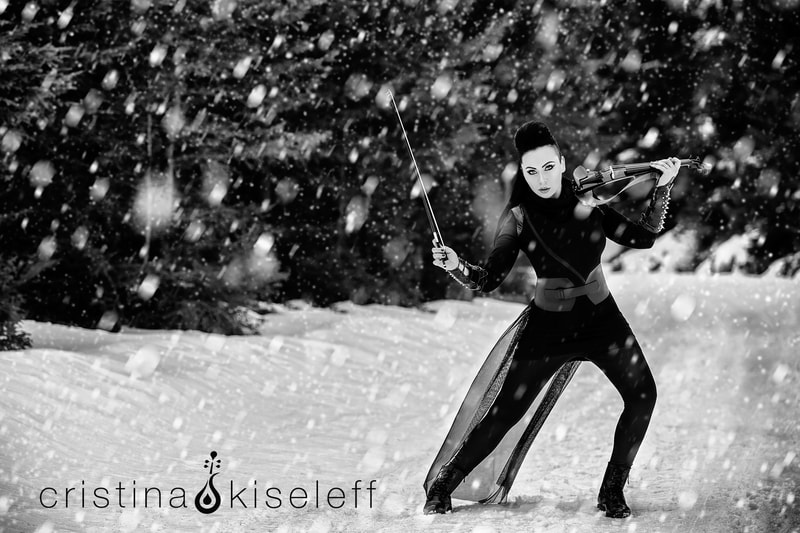 Cristina Kiseleff Electric Violinist Performing Polaris original violin song in a stormy winter snowing landscape
