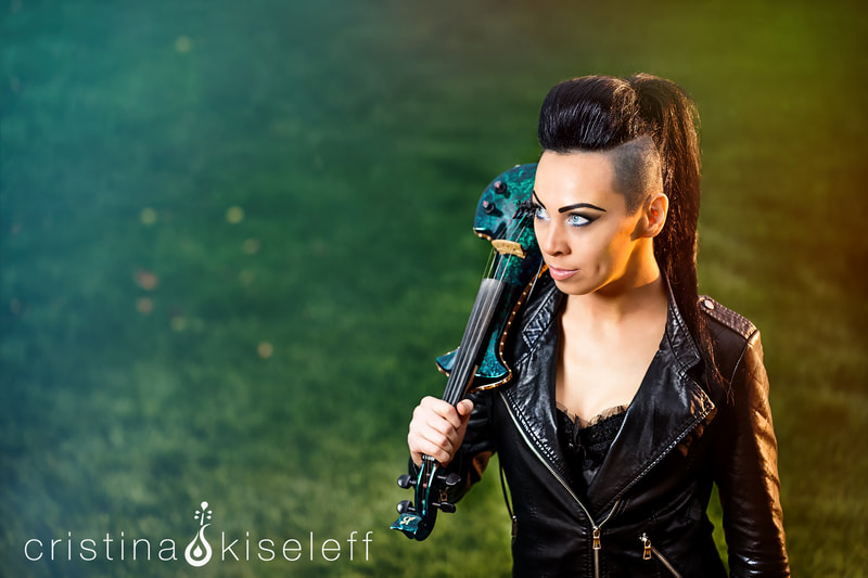 Cristina Kiseleff Electric Rockstar Violinist dressed in a dark corset with a rock leather jacket