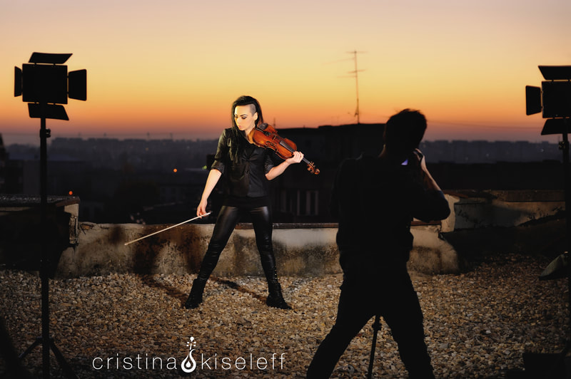 Cristina Kiseleff Electric Violinist performing on a rooftop creating a new violin music video for YouTube channel and TV