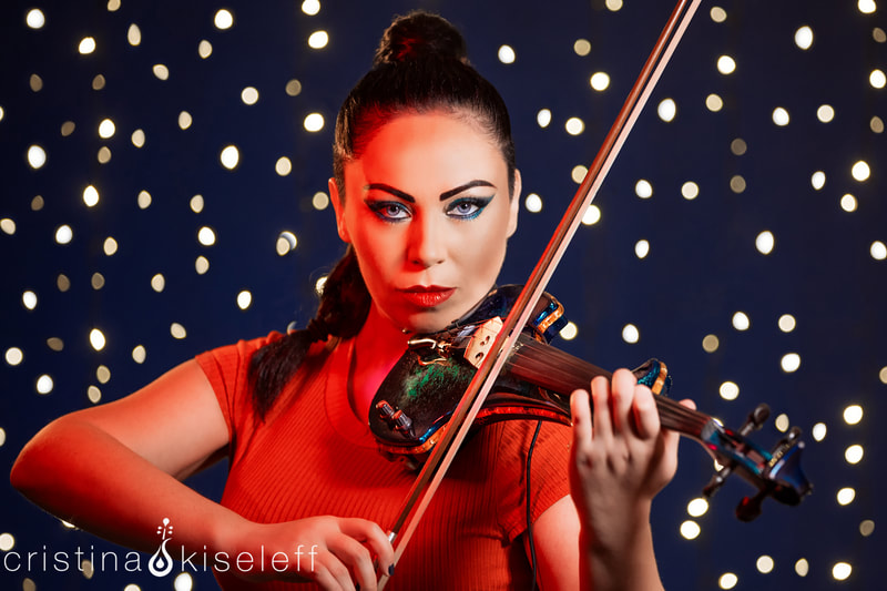 Cristina Kiseleff Electric Violinist Close Up Portrait with red body suit on a star light background