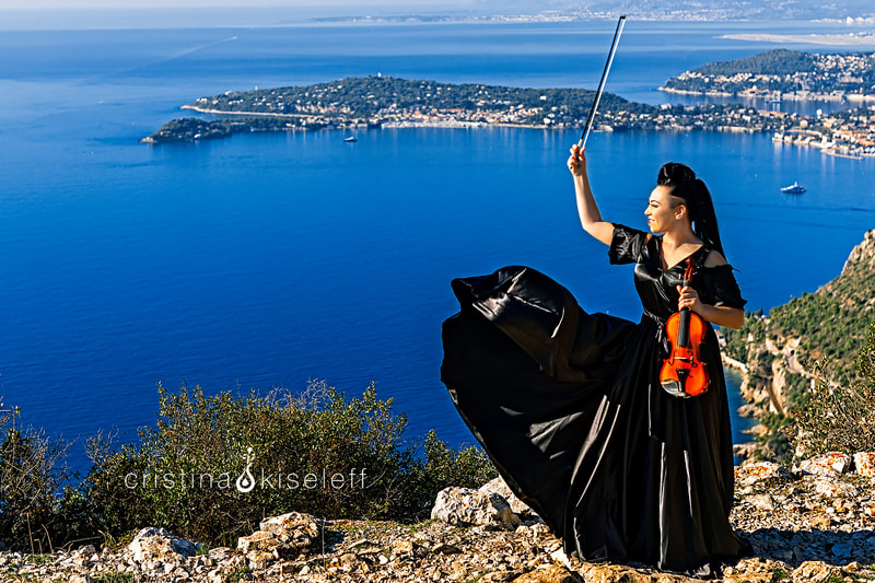 Cristina Kiseleff Electric Violinist Performing at the top of a mountain in the French Riviera mediterranean sea