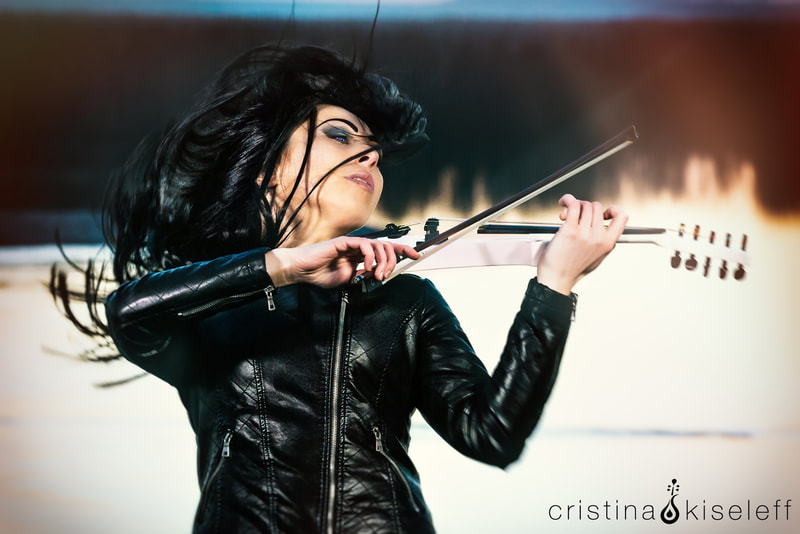 Cristina Kiseleff Electric Violinist Dramatic Portrait with hair in the wind playing a Cantini Violin